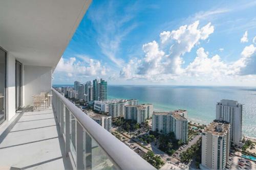 a balcony with a view of the ocean and buildings at Penthouse Ocean Front View Mansion in Sky Corner in Hollywood