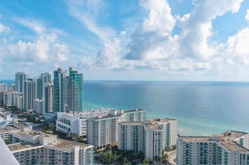 a view of a city with the ocean and buildings at Penthouse Ocean Front View Mansion in Sky Corner in Hollywood