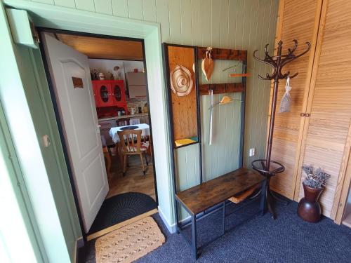 a room with a mirror and a wooden table at TUTTO Home in Frýdlant nad Ostravicí