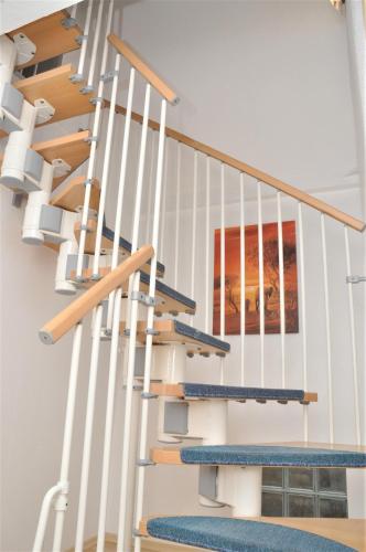 a set of stairs in a house with a painting at 200m² Wohnung in Walldorf - SAP in Walldorf