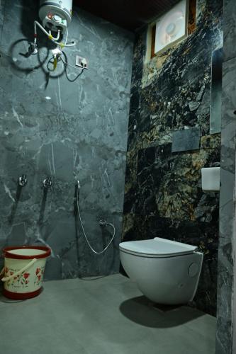 a bathroom with a shower and a toilet in it at Hotel raj inn in Lucknow