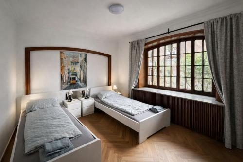 a bedroom with two beds and a window at BH Haus in Bremerhaven