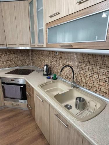 a kitchen with a sink and a stove at ANATOLI Waterfalls Retreat in Edessa
