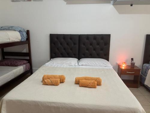 two towels on a bed in a bedroom at Tu casa en Ruta 34 - Wifi - Cochera -5 personas in Fernández