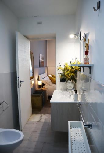 a bathroom with a sink and a toilet at Fortuna Guest House - Charm & Relax rooms in Syracuse