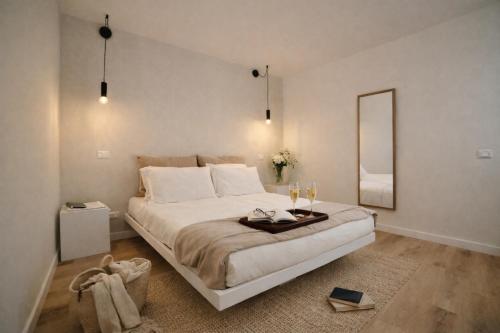 a bedroom with a large bed with a mirror at Residenza Ximenes Hub in Palermo