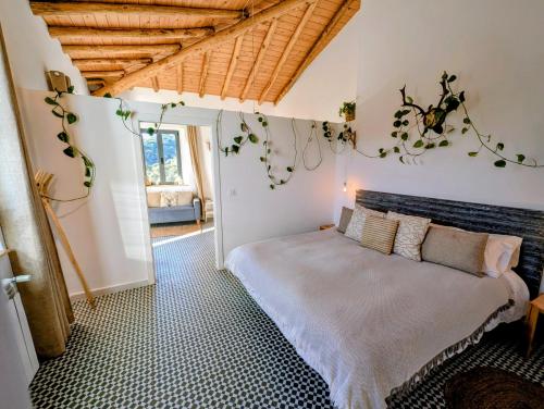 a bedroom with a large bed in a room at Finca Bravo in Cortegana