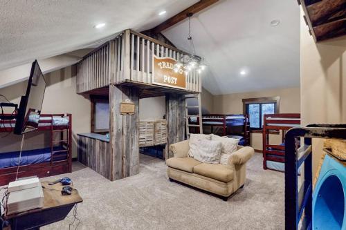 a living room with a couch and a chair at Raspberry Ridge Lodge in Fish Haven