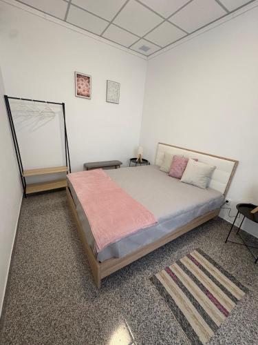 a bedroom with a large bed in a room at Casa São Marcos II in Peniche