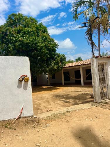 a house with a gate with a pair of goggles on it at Casa Ale in Brisas de Zicatela
