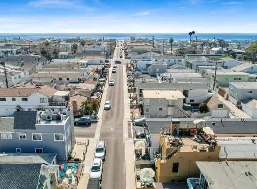 an aerial view of a city with cars driving down a street at Contemporary Value 4 Bdr, with Rooftop Deck- 303 home in Newport Beach