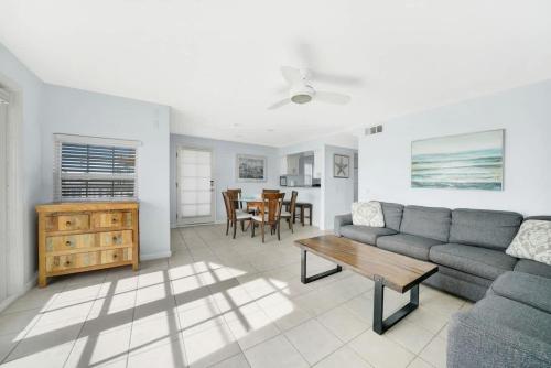 a living room with a couch and a table at Ocean and Scenic Beach Views From Deck apts in Newport Beach