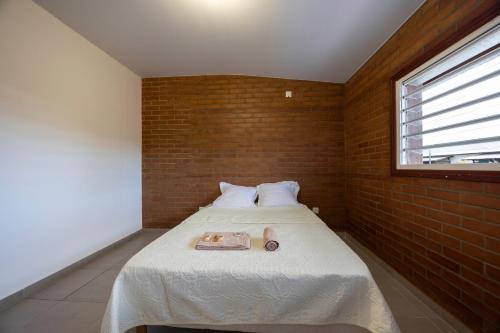 a bedroom with a bed with a towel on it at Macapa - Destination Guyane in Macouria