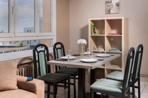 a dining room with a table and chairs at Hotel Regina & Spa in Berck-sur-Mer