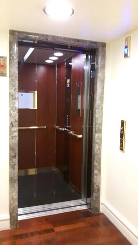 a walk in shower in a room with a glass door at Grand Hotel Piazza Borsa in Palermo