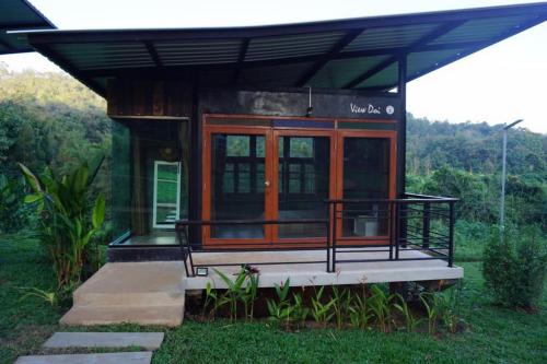 a tiny house in the middle of a field at Phu Pha View Doi in Samoeng