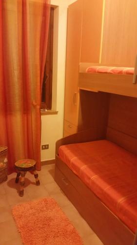a bedroom with two bunk beds and a window at Cornino Relax in Custonaci