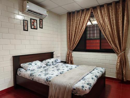 a bedroom with a bed and a window at UDUPI HOMESTAY - Cottage House - Dendoorkatte, Udupi in Udupi