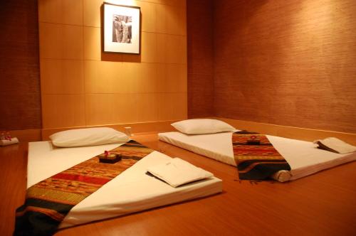 Cama o camas de una habitación en Ellaa Hotel Gachibowli