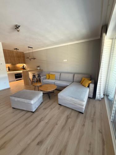 a living room with a couch and a table at ApartmanBrezovina217 in Veselé