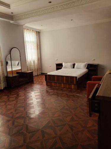 a large bedroom with a bed and a couch at Aster Mekuria in Addis Ababa