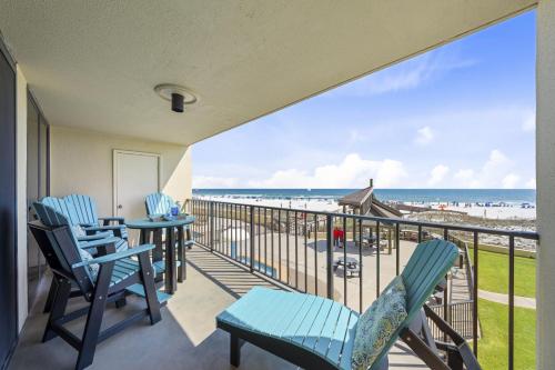 a balcony with chairs and a view of the beach at Phoenix II 2012 in Orange Beach