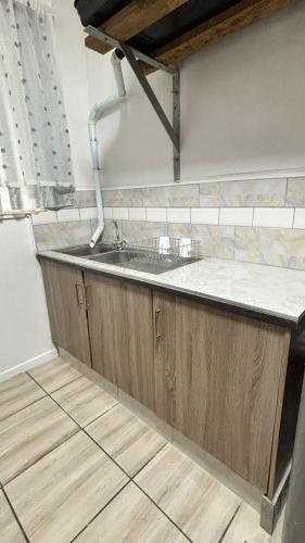 a kitchen with a sink and a counter at One Thirty Six in Gqeberha