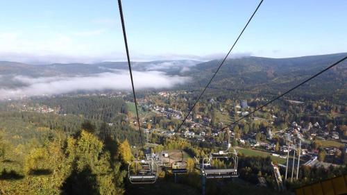 a gondola ride in the air over a city at Hotel Anna in Harrachov