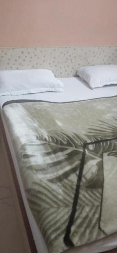 a close up of a bed in a room at Hotel Raj Guest House in Jaipur