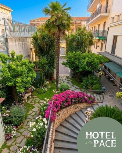a view of a garden with flowers on a staircase at Hotel Pace in Pompei