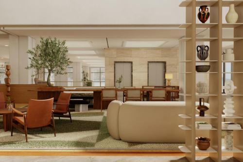 a living room with a couch and a table at Sheraton Rhodes Resort in Ixia