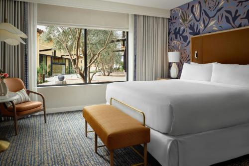 a hotel room with a large bed and a window at Hotel Solea, Autograph Collection in Carlsbad