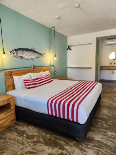 Llit o llits en una habitació de Mas Basico Hotel