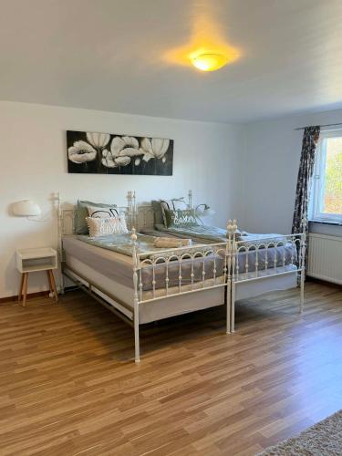 a bedroom with a large bed in a room at M & M home in Karlshamn