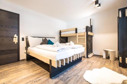 Cama o camas de una habitación en Blackriver Lodge Saalbach - inkl CrossFit Gym