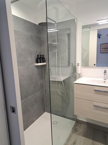 a bathroom with a shower and a sink at BEACHITO Puerto Naos in Puerto Naos