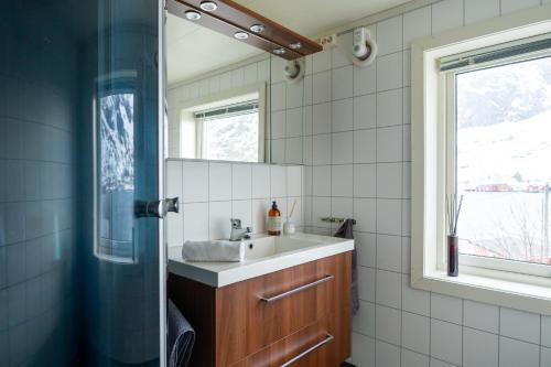 a bathroom with a sink and a mirror at Villa valen, Reine in Moskenes