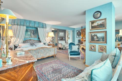 a bedroom with a bed and a living room at Historic Cinema Suite with Private Art Collection - Basel in Basel