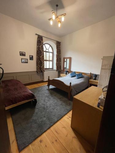 a bedroom with a bed and a window at Beldy Chapel Ground floor apartment in Alston