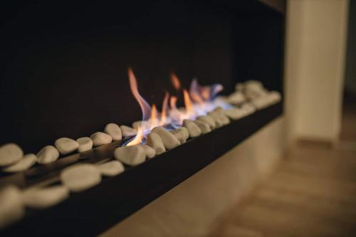 a close up of a fireplace with a fire at Apartman Prime - free parking in Belgrade
