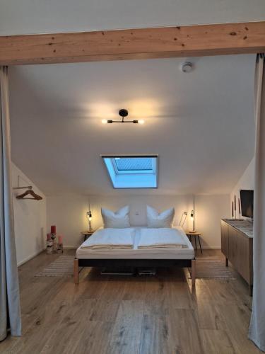 a bedroom with a bed and a skylight at Apartment Romi in Bad Waldsee