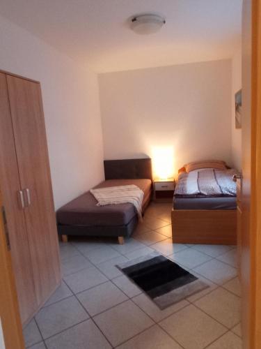 Llit o llits en una habitació de FEWO Caro