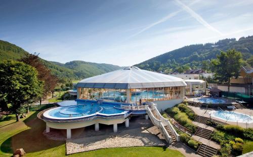 an aerial view of a resort with two swimming pools at Pension Genz in Bad Karlshafen
