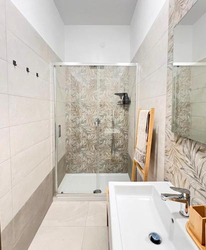 a bathroom with a shower and a sink at Casa Lupoli in Caserta