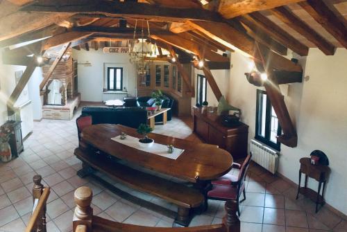 a living room with a wooden table and a couch at Toulouse in Bazus