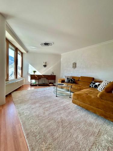 a living room with two couches and a piano at Molive in Traben-Trarbach