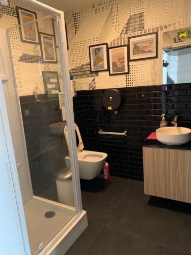 a bathroom with a toilet and a sink at Espace entier Centre de Paris in Paris