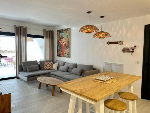 a living room with a table and a couch at Casa Domino in Villaverde