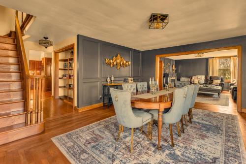 a dining room with a table and chairs at The John Collins House in Canfield