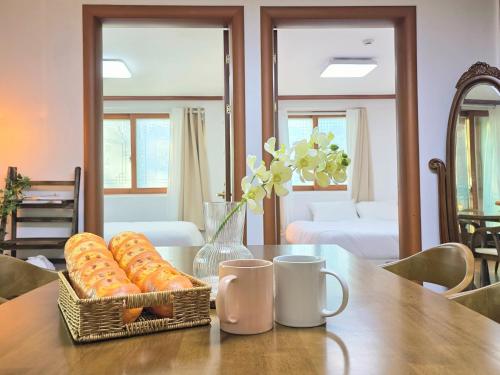 a basket of donuts sitting on top of a table at Wizday Stay in Suwon
